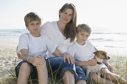 Family sitting on the beach Family sitting on the beach